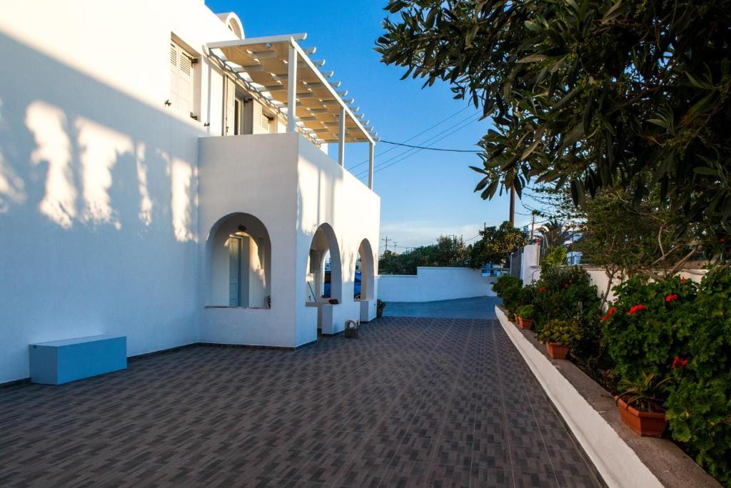 Whitewashed exterior and arched walkways of Luna Rossa